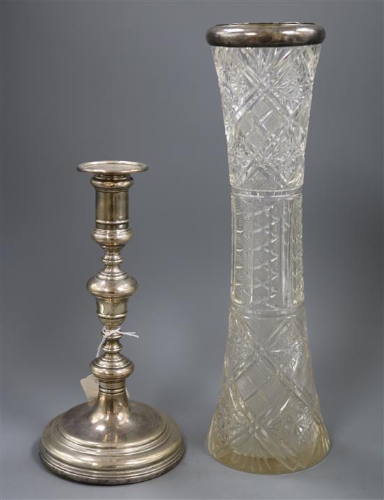 A 1920s silver candlestick and a late Victorian silver mounted tall glass vase.